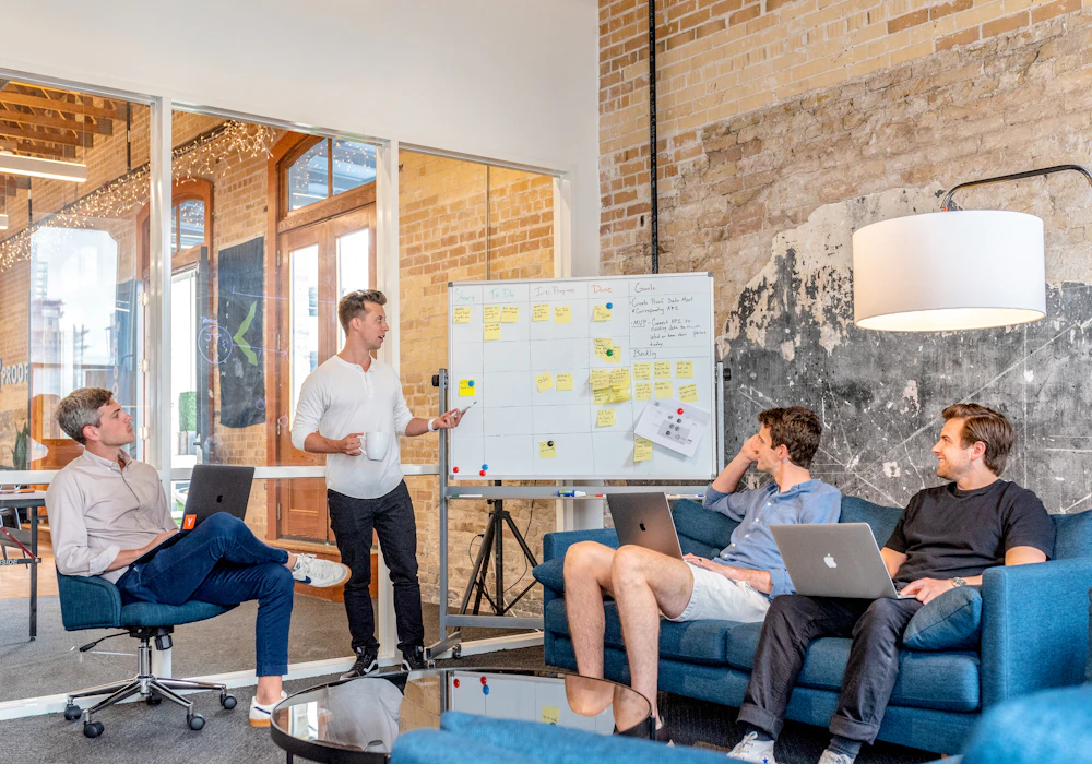 Team planning together around a whiteboard