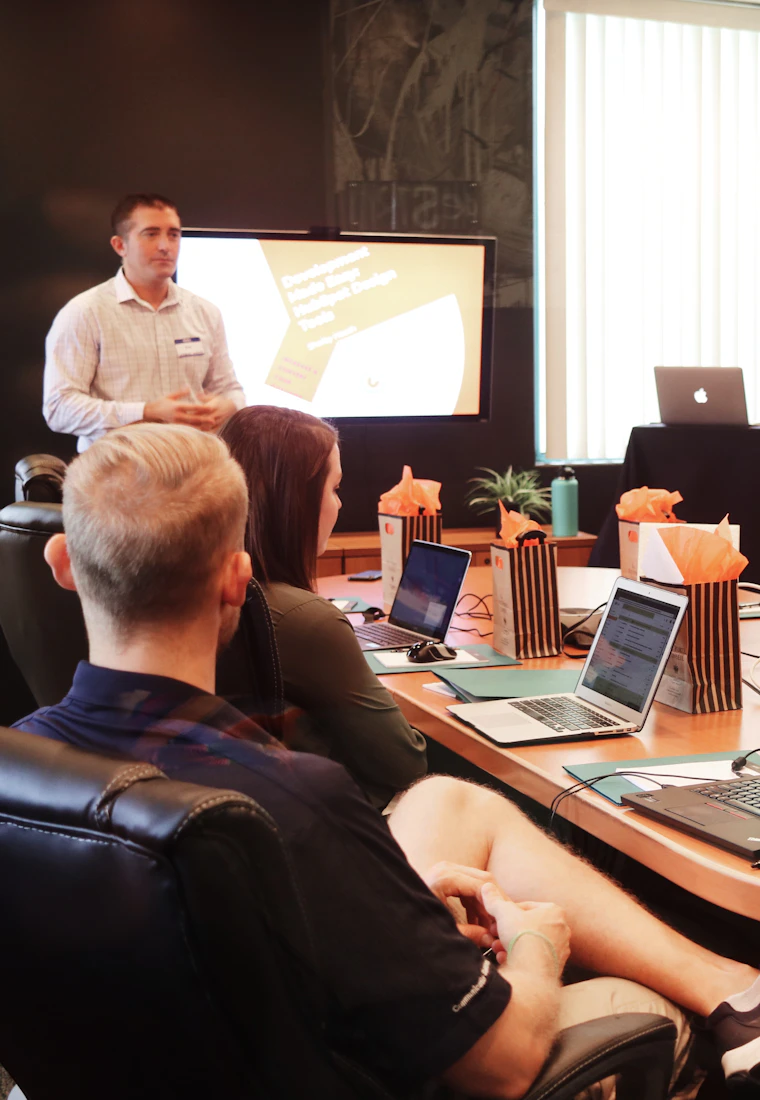 Team meeting with a presentation on screen